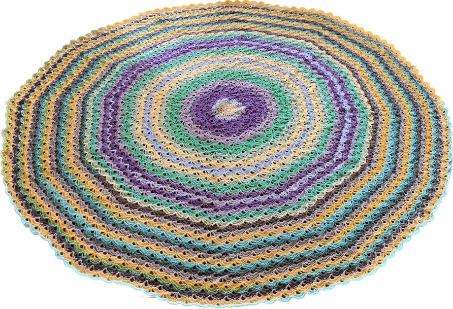 round crochet blanket with a shell pattern