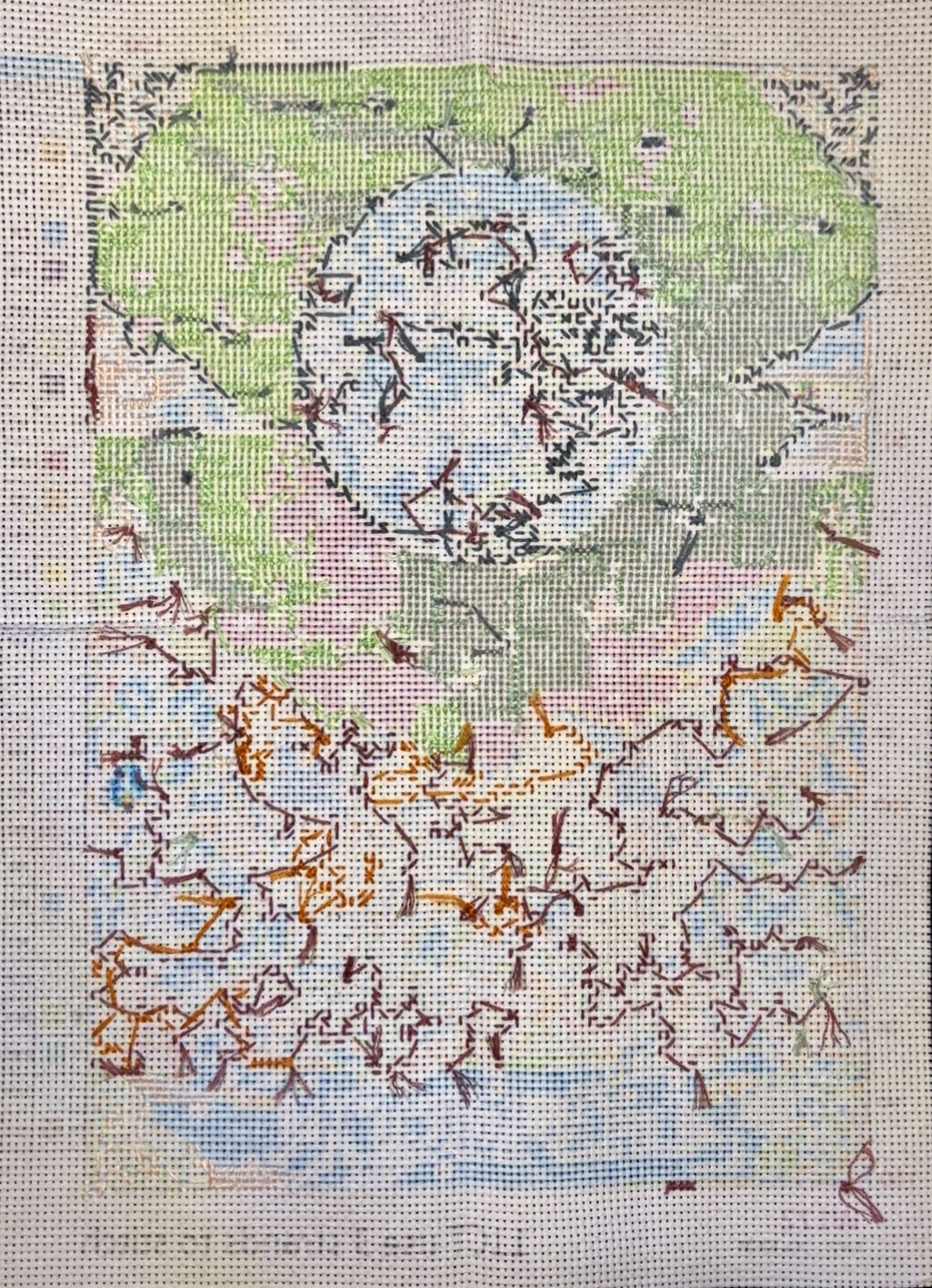 the backside of a tarot-themed cross stitch pattern of The Moon