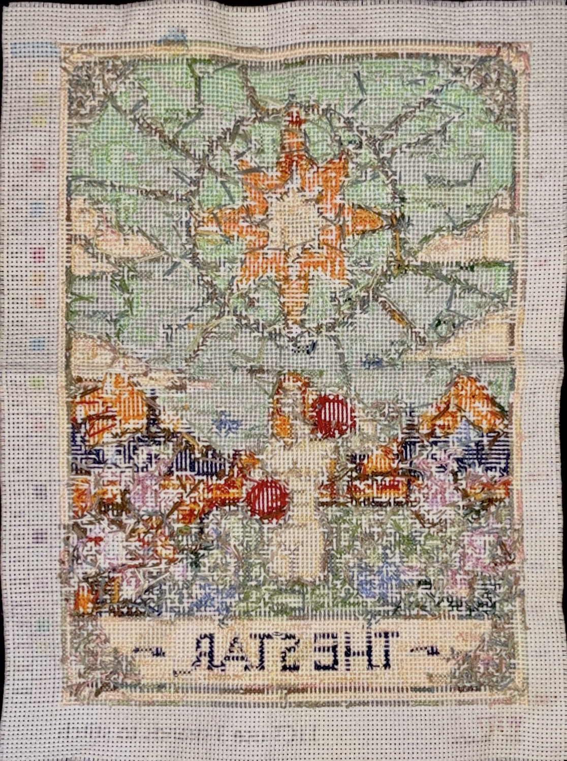 the backside of a tarot-themed cross stitch pattern of The Star