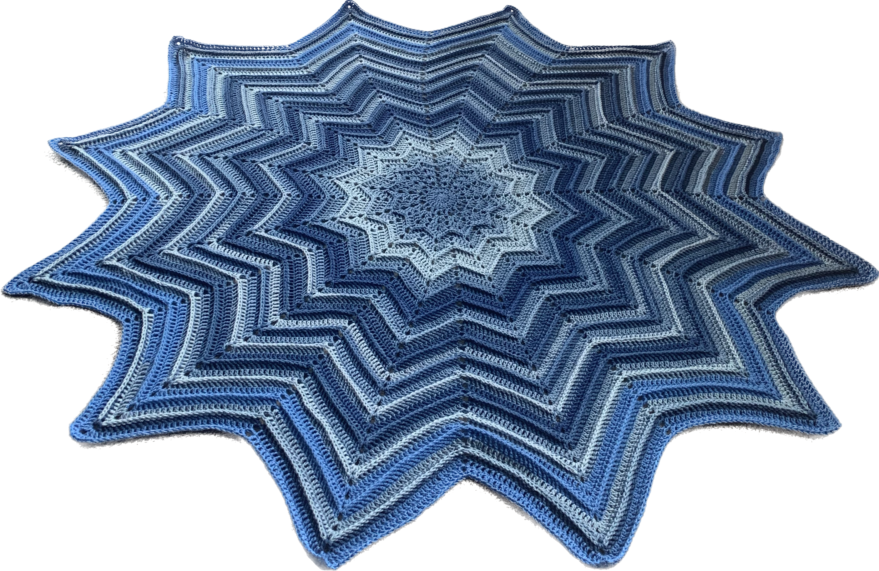 12 point star crochet blanket in various shades of blue